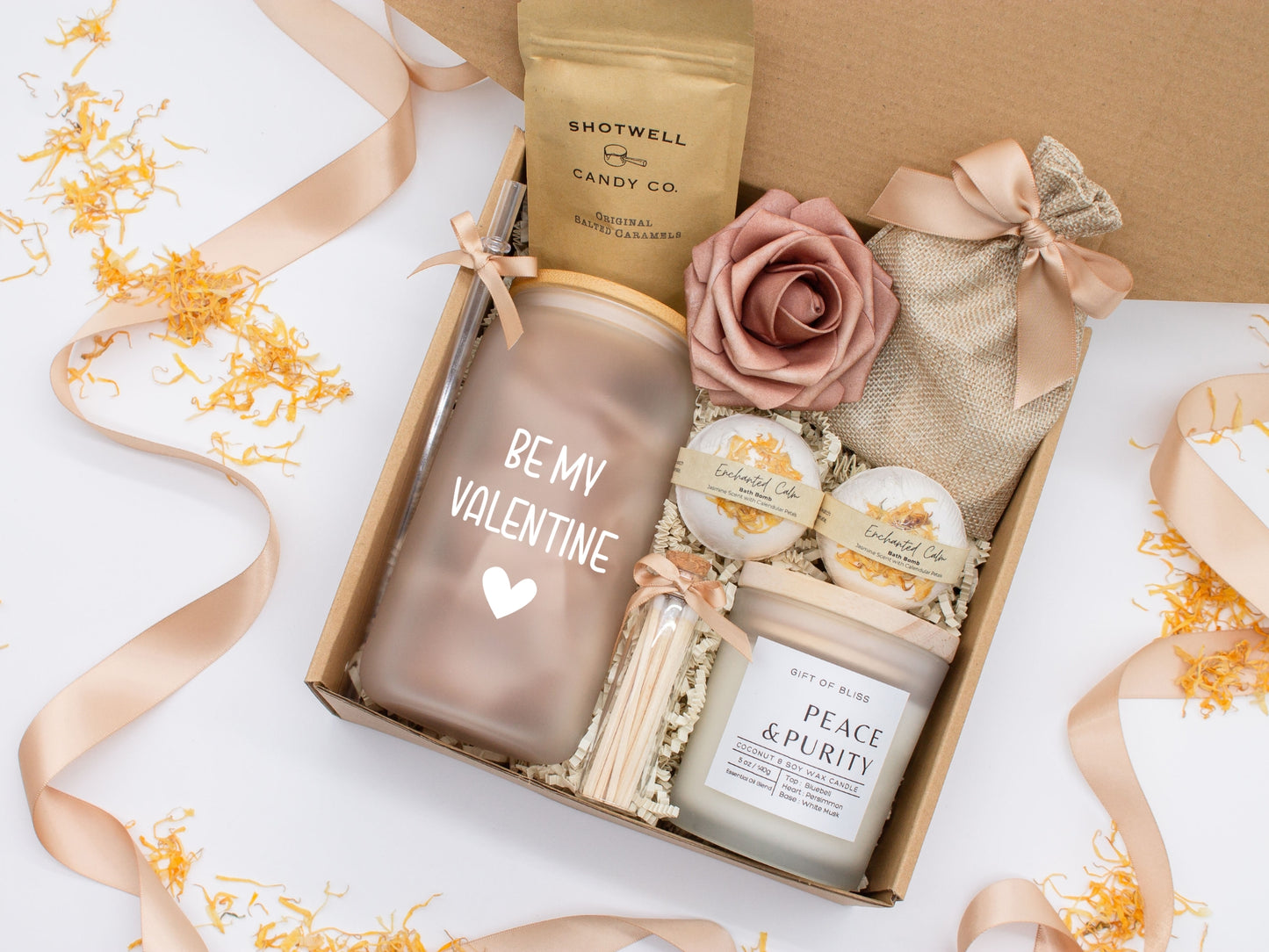 Spa gift basket for her with fragrant bath treats, glass cup, soft caramels, relaxing candle, and a beautifull rose. Pick from one of the three scents: Rose, Lavender, or Jasmine. Perfect to pamper and honor her.