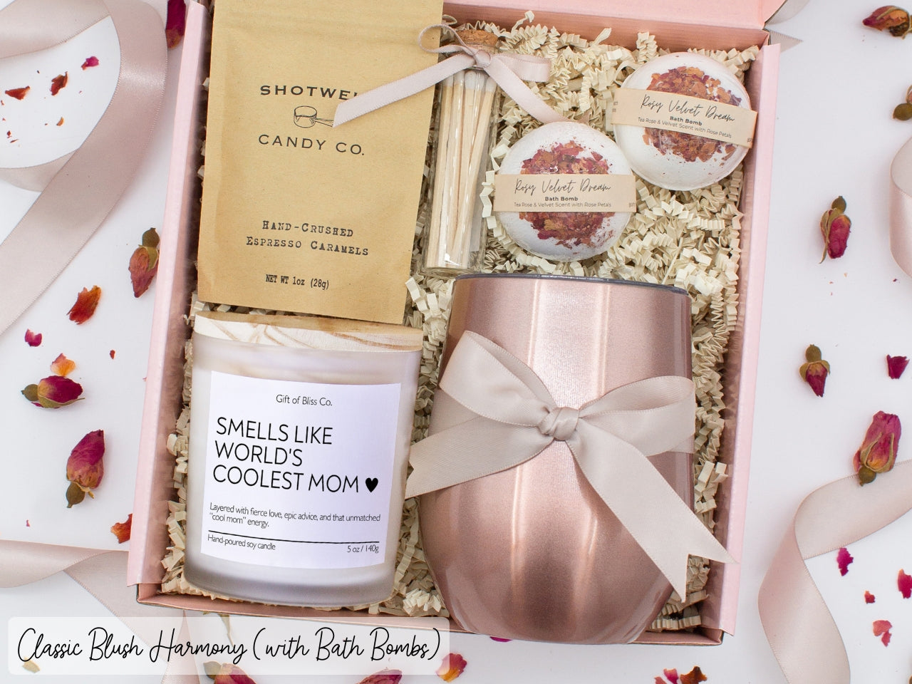 Luxury gift box for mom. Featuring a stainless steel tumbler, an aromatherapy candle with mom-themed label and charming match jar, luxury bath bombs, and gourmet caramel treats. All items are beautifully arranged for a pampering experience.
