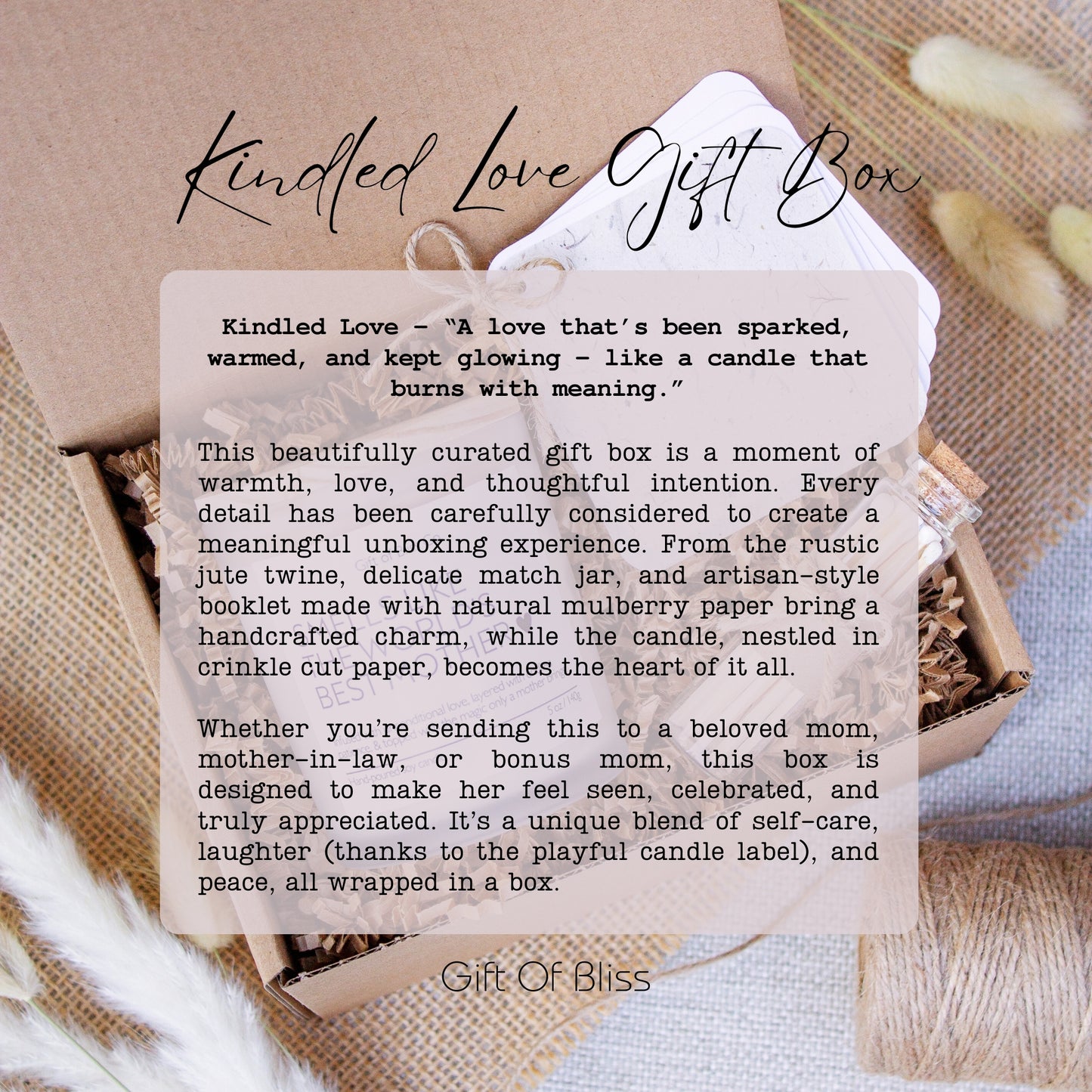 Image featuring the “Kindled Love Gift Box” from Gift of Bliss. The text overlay describes the box as a heartfelt gift filled with warmth, care, and handcrafted charm. It highlights thoughtful details like a rustic jute twine bow, delicate match jar, and an artisan-style booklet made from natural mulberry paper. Designed to bring peace, laughter, and appreciation, it’s ideal for moms, mother-in-laws, or bonus moms. Background shows the box contents styled beautifully.