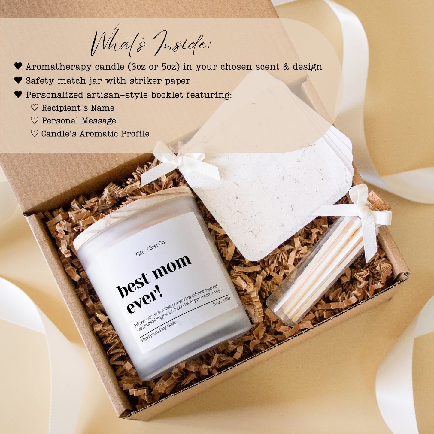 Candle gift box featuring a “best mom ever” soy candle, glass match jar, and a personalized message booklet tied with ivory ribbon. Arranged in a kraft box with crinkle paper filler and neutral tones, this cozy, elegant, handcrafted gift is perfect for Mother’s Day or mom appreciation. A heartfelt and aesthetic set that combines warmth, functionality, and luxury charm.