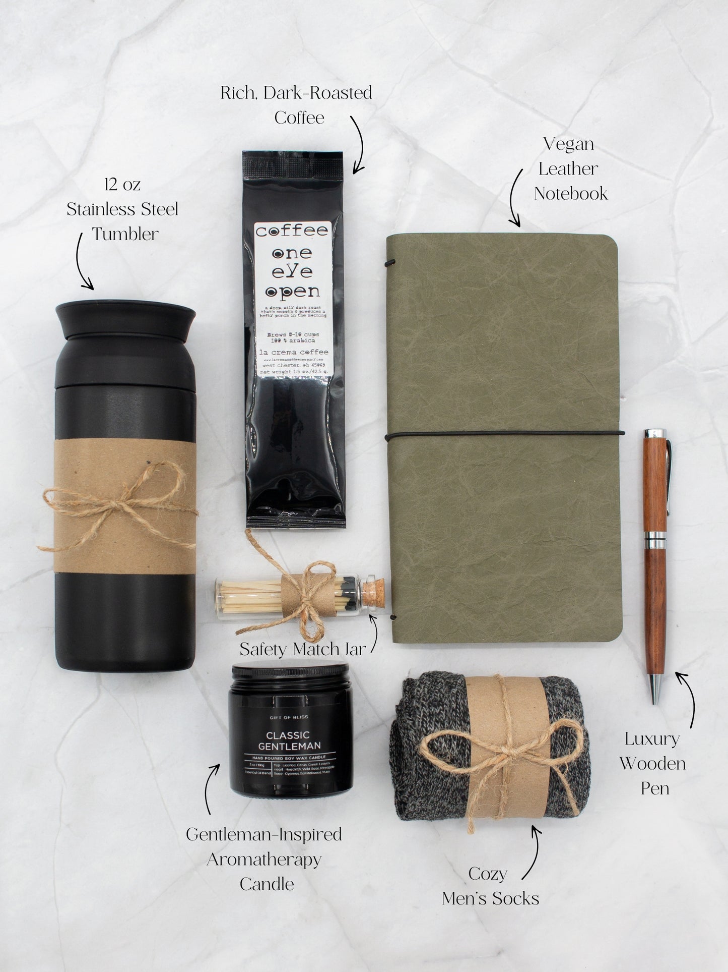 Specially crafted gift box for men, suitable for anyone valuing timeless style. Includes a stainless steel tumbler, coffee, aromatherapy candle, men's socks, notebook, and a wooden pen. A perfect gift for a comforting & indulgent experience.