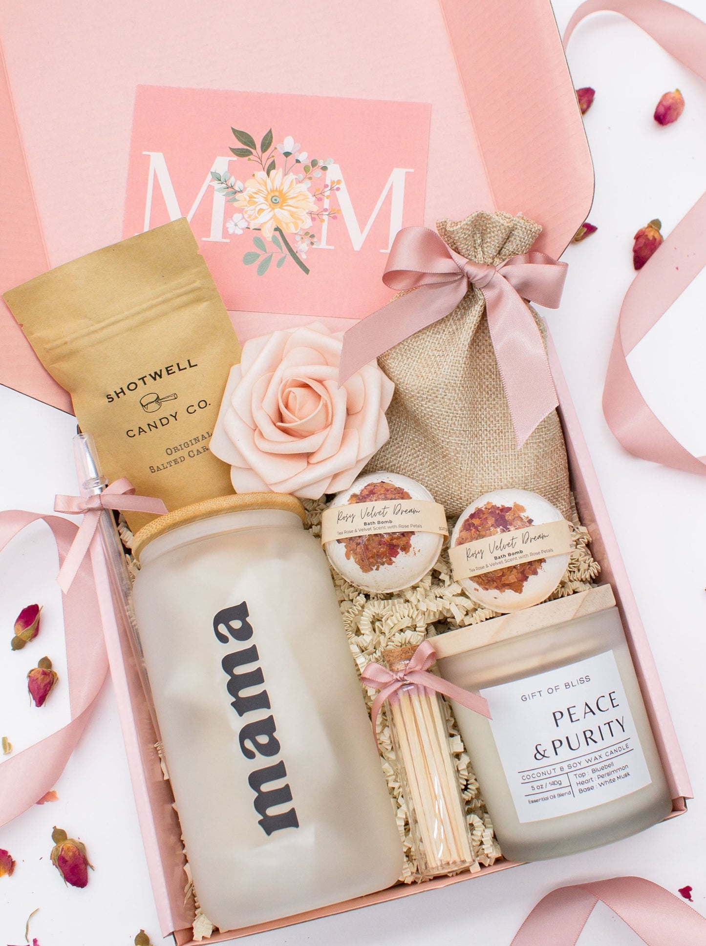 Cherished Mom gift box with fragrant bath treats, a Mama glass cup, soft caramels, a relaxing candle, and a beautifull rose. Pick from one of these three scents: Rose, Lavender, or Jasmine. Perfect to pamper and honor moms.