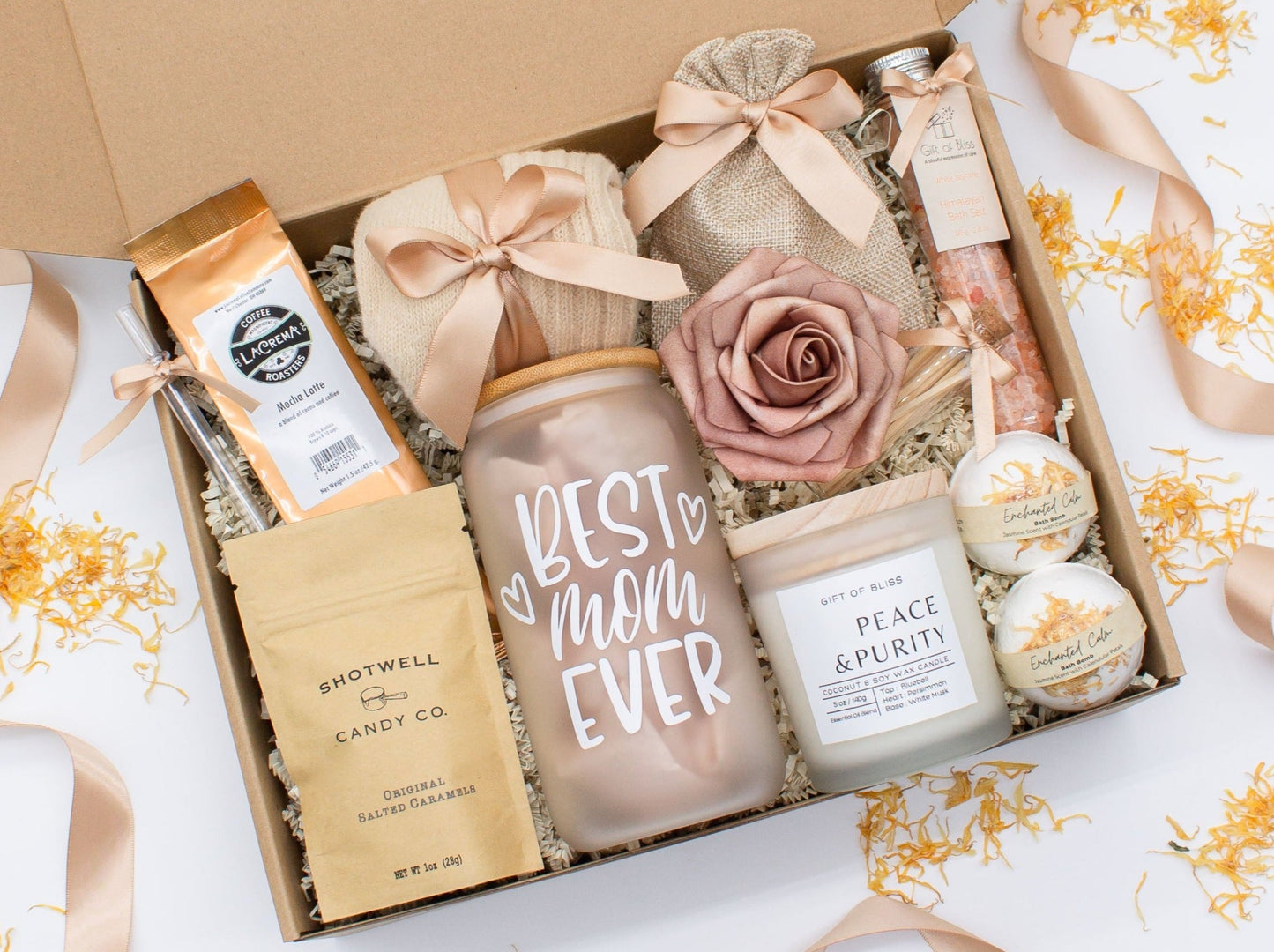 Mom gift box with fragrant bath treats, Best Mom Ever glass cup, mocha latte coffe, soft caramels, relaxing candle, cozy socks, and a beautifull rose. Pick from one of the three scents: Rose, Lavender, or Jasmine. Perfect to pamper and honor moms.