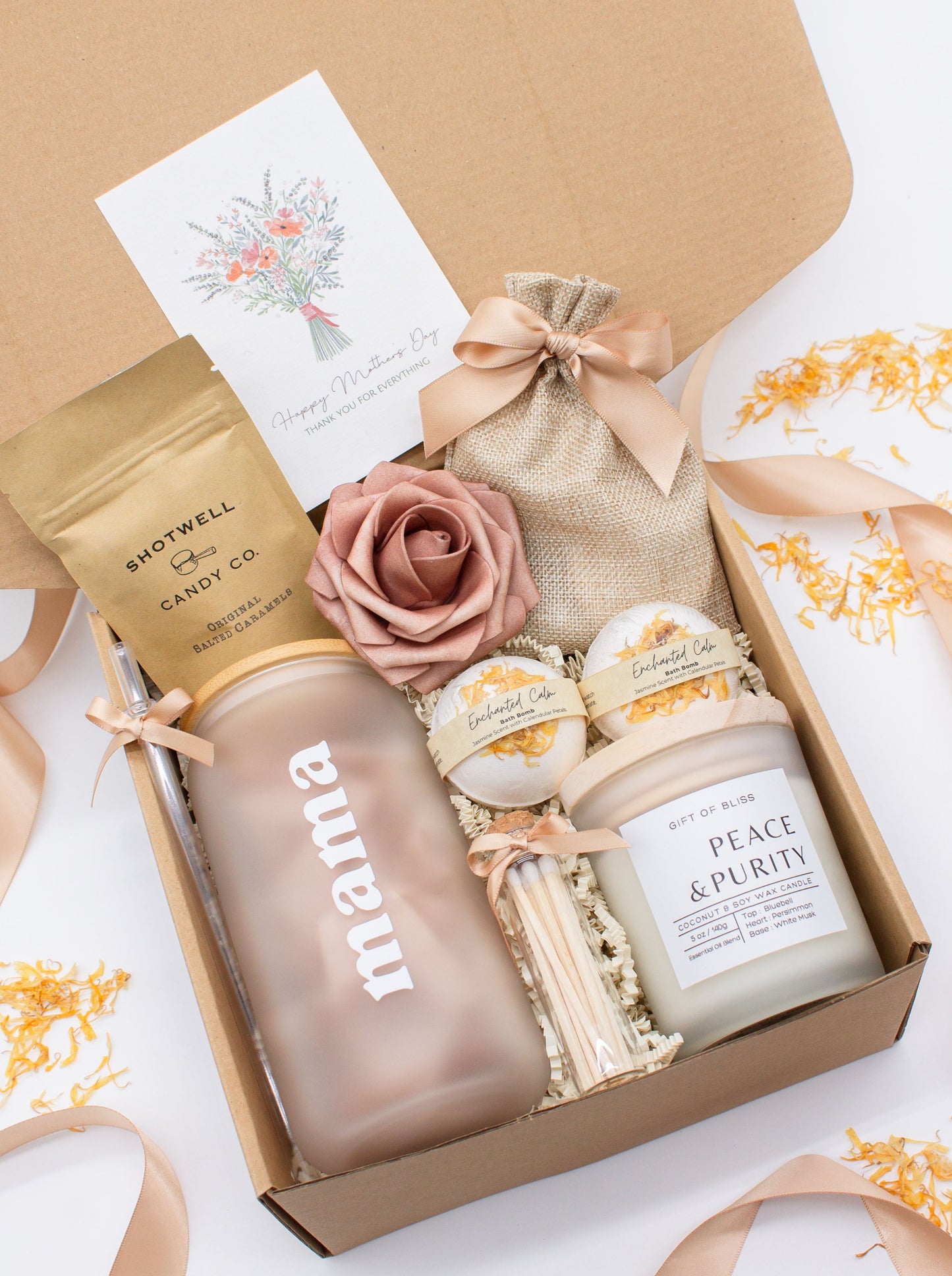 Cherished Mom gift box with fragrant bath treats, a Mama glass cup, soft caramels, a relaxing candle, and a beautifull rose. Pick from one of these three scents: Rose, Lavender, or Jasmine. Perfect to pamper and honor moms.