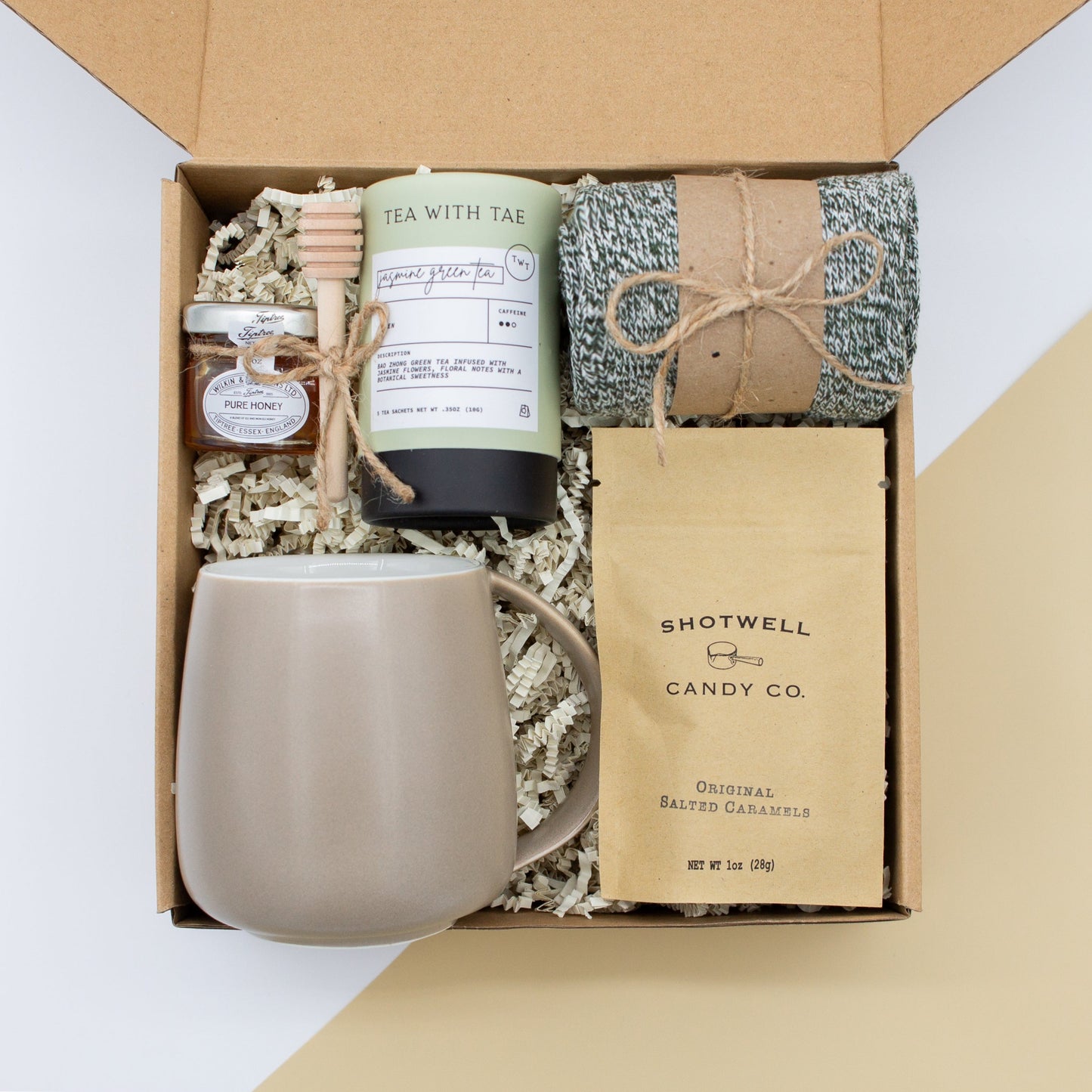 The Dapper Haven Basic (Specially crafted gift box for men. Includes a minimalist ceramic mug, tea, pure honey with wooden dipper, caramel candy, and cozy men's socks. A gift that brings joy and a touch of tranquility to anyone who loves life's finer things.)