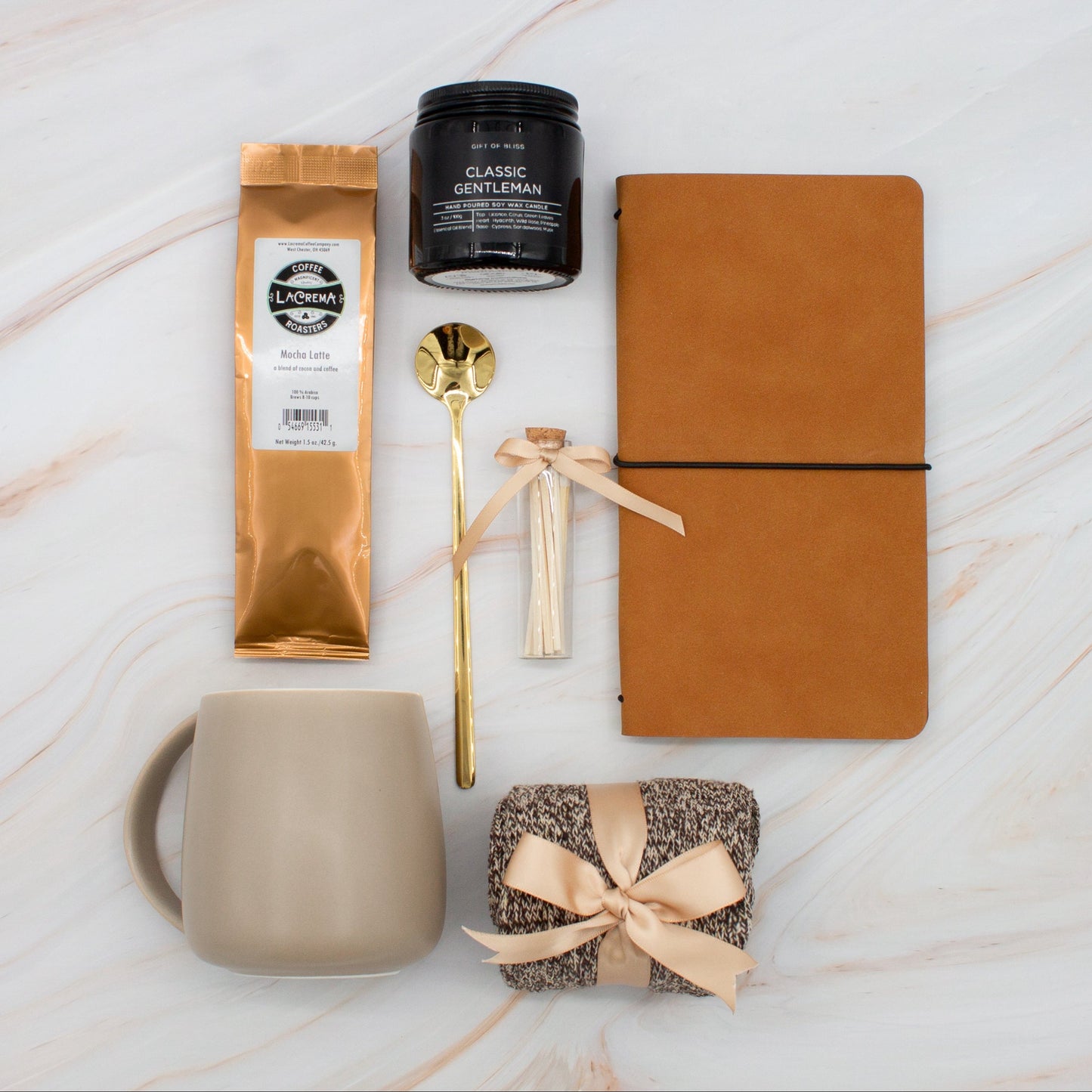 Urban Comfort (Specially crafted gift box, ideal for modern individuals who value style and comfort. Includes 12 oz ceramic mug, long-handled golden spoon, rich coffee, aromatic candles and matches, stylish men's socks, and notebook, all arranged for a memorable experience.)