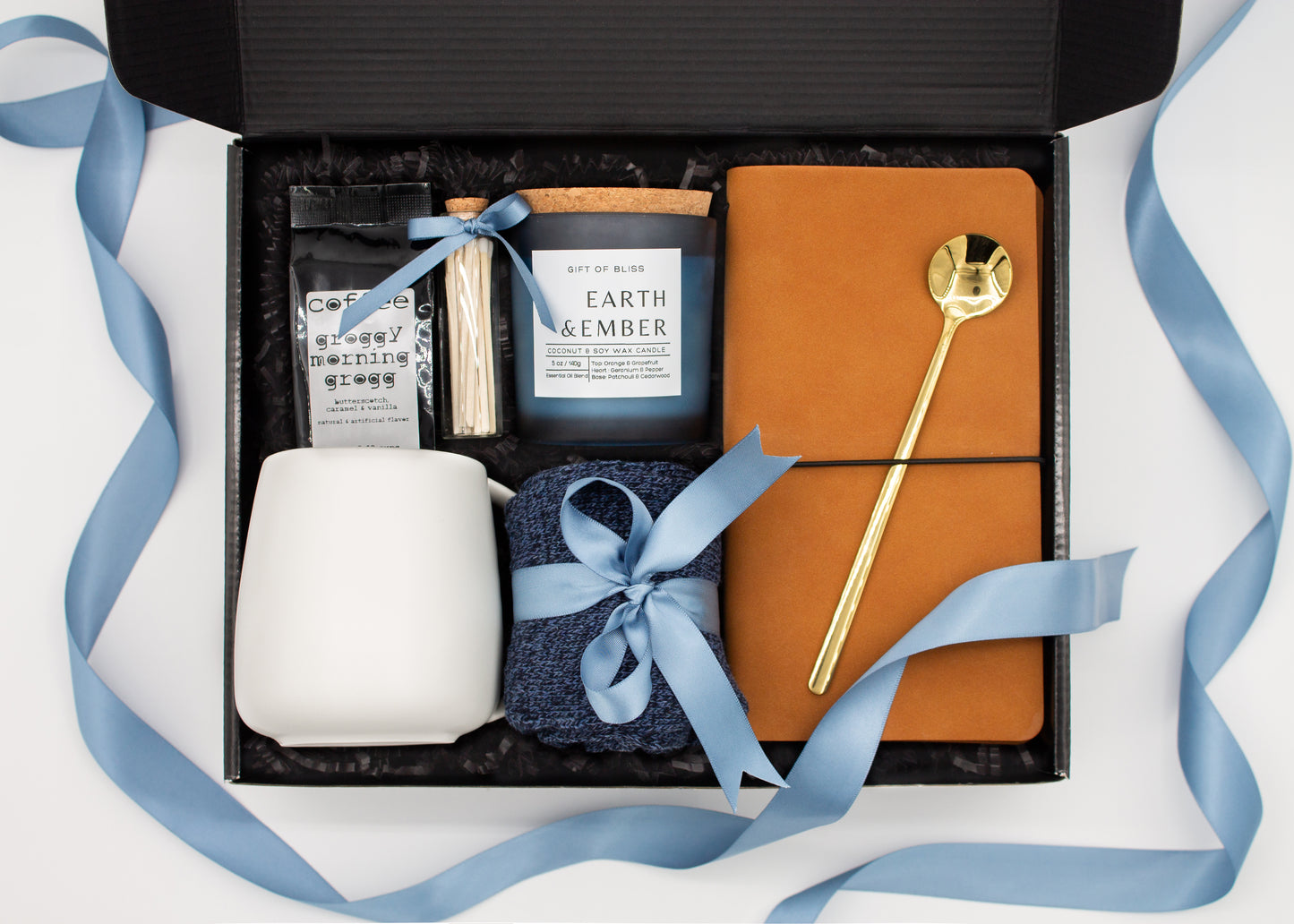 Urban Comfort (Specially crafted gift box, ideal for modern individuals who value style and comfort. Includes 12 oz ceramic mug, long-handled golden spoon, rich coffee, aromatic candles and matches, stylish men's socks, and notebook, all arranged for a memorable experience.)