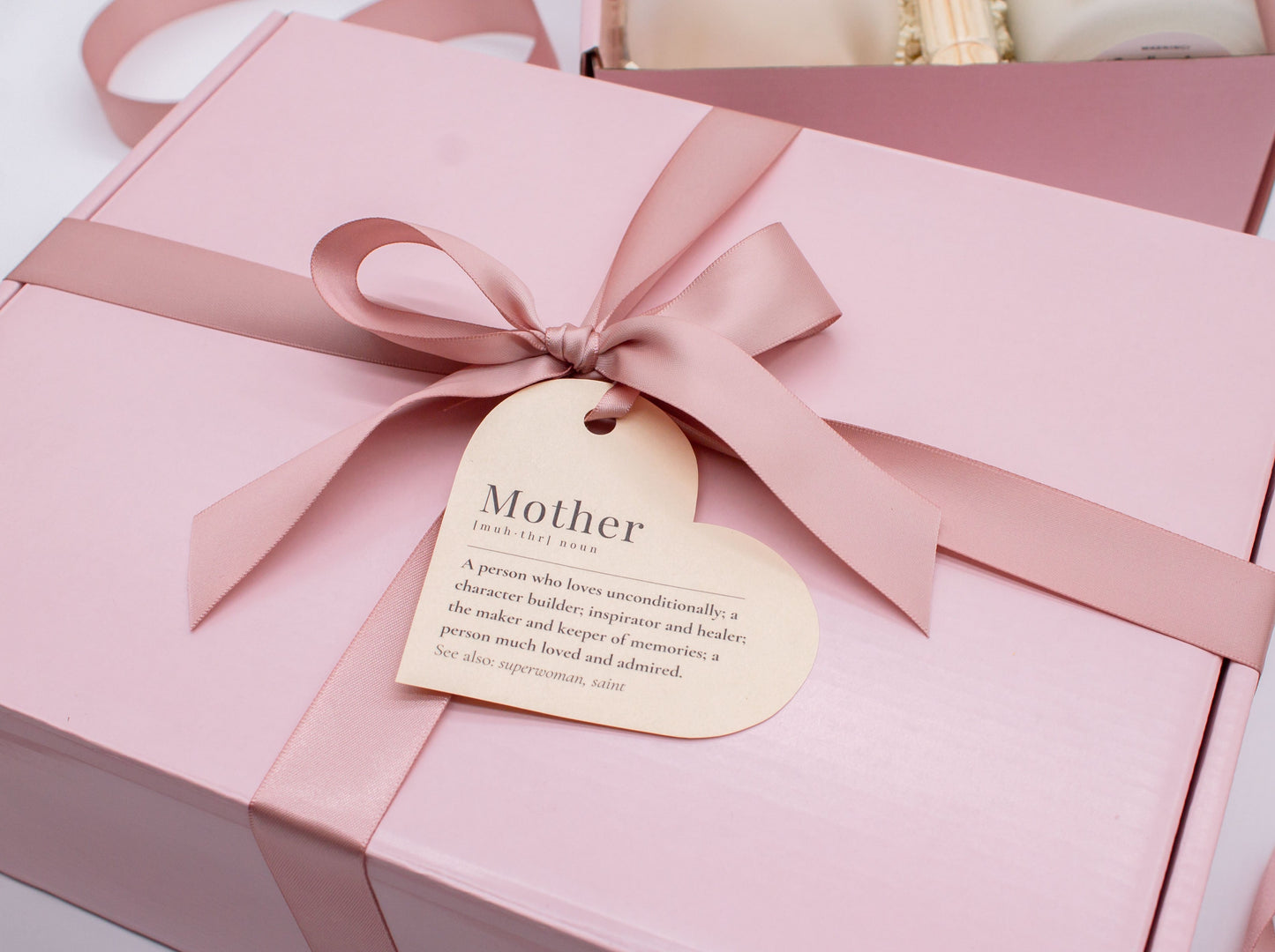 Mom gift box with fragrant bath treats, Best Mom Ever glass cup, mocha latte coffe, soft caramels, relaxing candle, cozy socks, and a beautifull rose. Pick from one of the three scents: Rose, Lavender, or Jasmine. Perfect to pamper and honor moms.