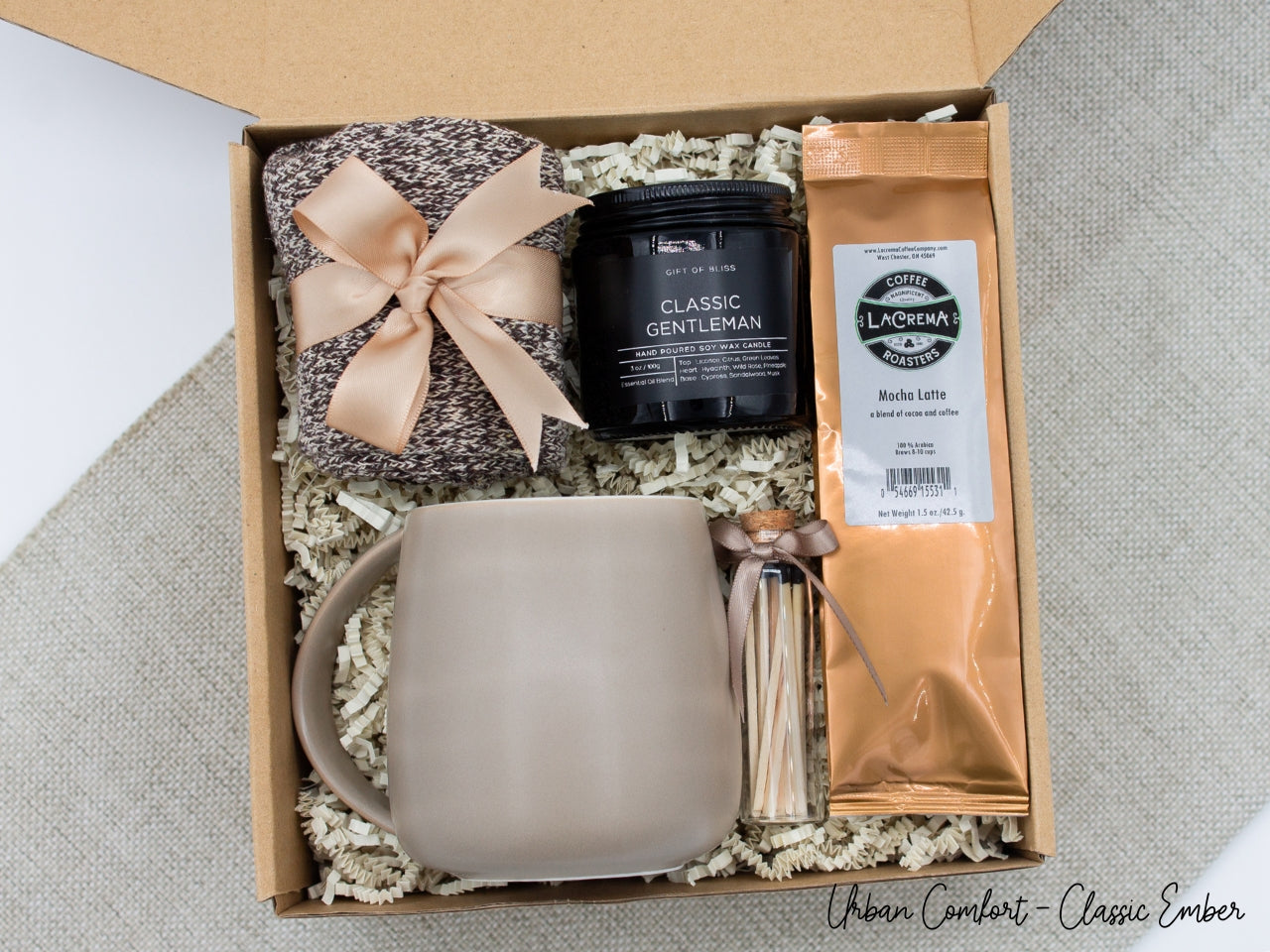 Specially crafted gift box, ideal for modern individuals who value style and comfort. Includes 12 oz ceramic mug, selection of coffee flavors, aromatic candles and matches, and stylish mens socks, all arranged for a memorable experience.