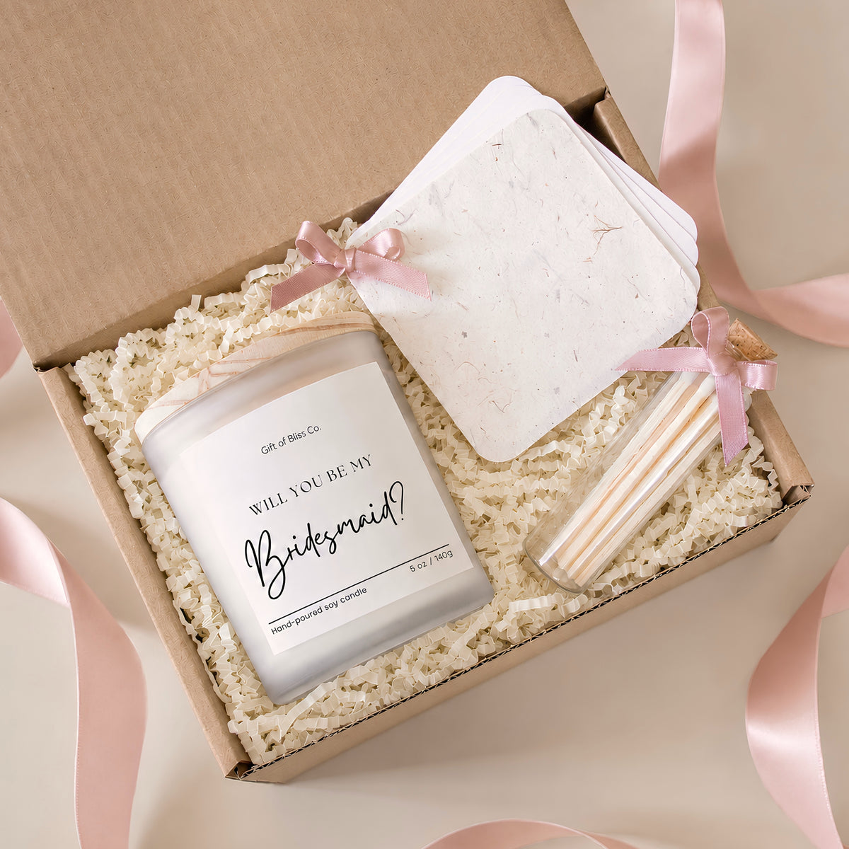 Will You Be My Bridesmaid candle in a frosted jar with matches and keepsake booklet tied with pink ribbon in a kraft gift box