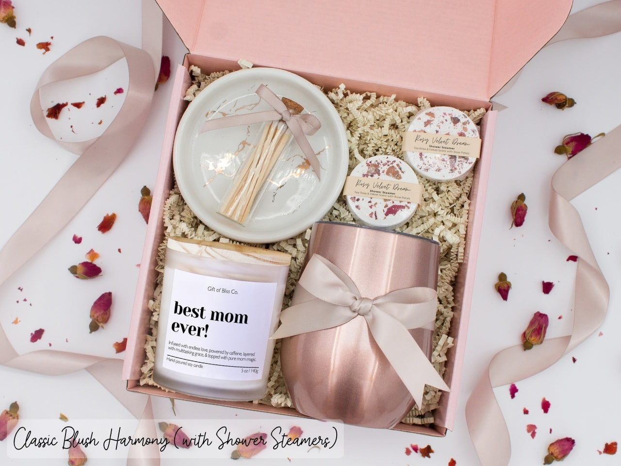 Luxury gift box for mom. Featuring a stainless steel tumbler, an aromatherapy candle with mom-themed label and charming match jar, aromatic shower steamers, and a sleek ceramic dish. All items are beautifully arranged for a pampering experience.