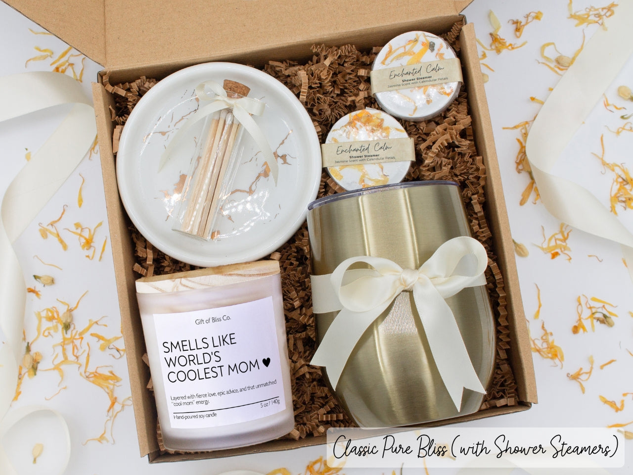 Luxury gift box for her. Featuring a stainless steel tumbler, an aromatherapy candle with mom-themed label and charming match jar, aromatic shower steamers, and a sleek ceramic dish. All items are beautifully arranged for a pampering experience.