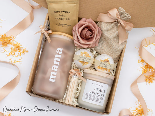 Cherished Mom gift box with fragrant bath treats, mom designed glass cup, soft caramels, a relaxing candle, and a beautifull rose. Pick from one of these three scents: Rose, Lavender, or Jasmine. Perfect to pamper and honor moms.