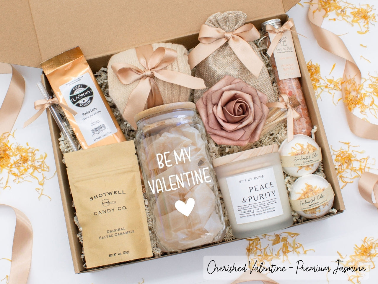 Personalized Valentine's Day spa gift set for her with bath treats, personalized glass tumbler, mocha latte coffe, caramels, relaxing candle, cozy socks, and a lovely rose. Pick from 1 of the three scents: Rose, Lavender, or Jasmine. Perfect to pamper and honor her.