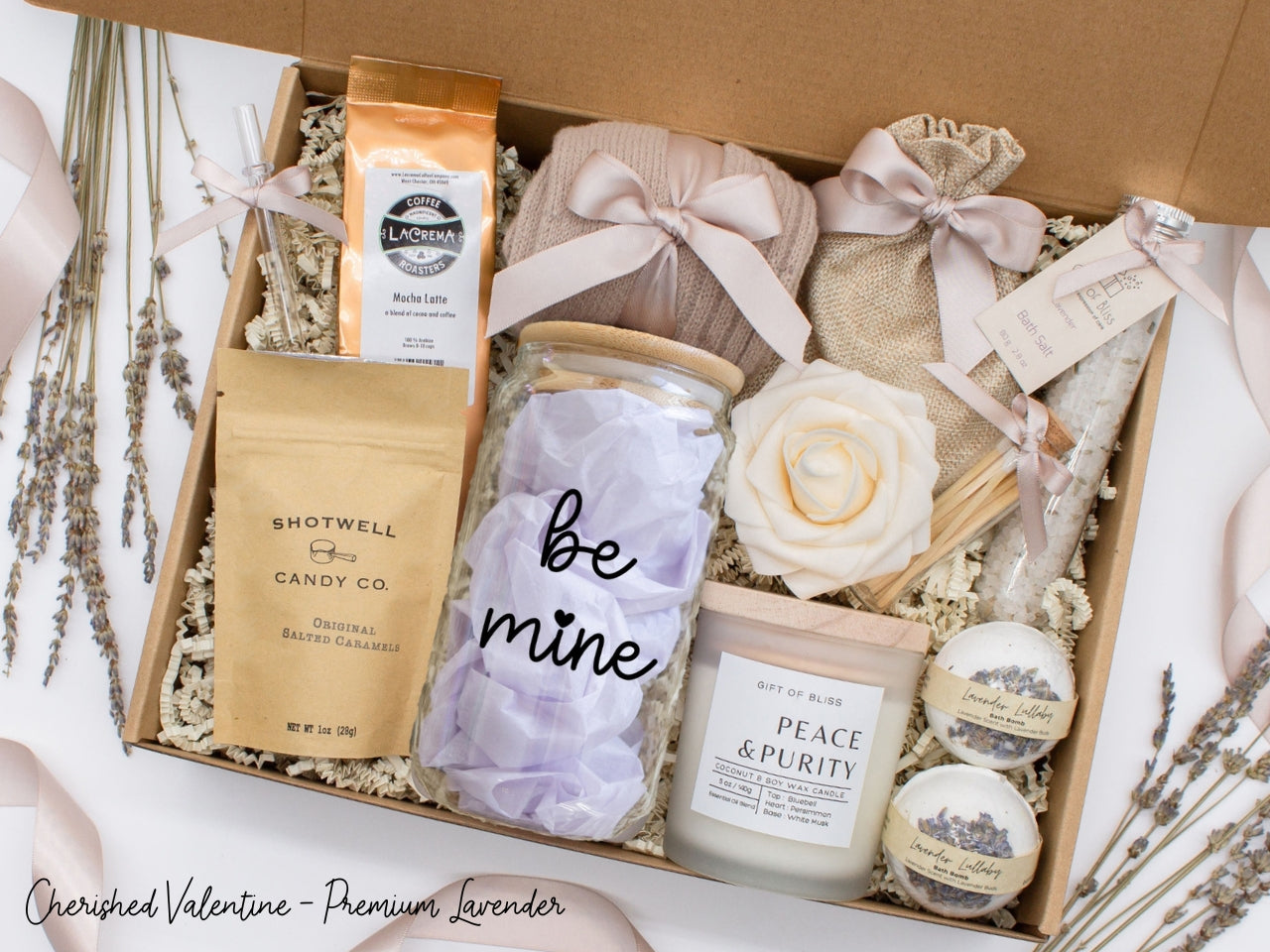 Personalized Valentine's Day spa gift set for her with bath treats, personalized glass tumbler, mocha latte coffe, caramels, relaxing candle, cozy socks, and a lovely rose. Pick from 1 of the three scents: Rose, Lavender, or Jasmine. Perfect to pamper and honor her.