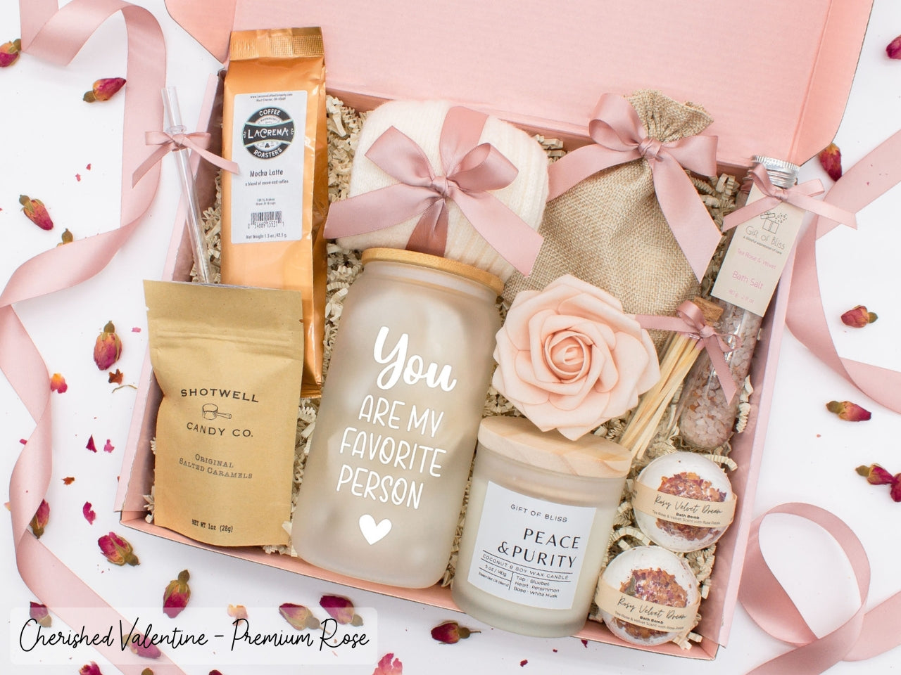 Personalized Valentine's Day spa gift set for her with bath treats, personalized glass tumbler, mocha latte coffe, caramels, relaxing candle, cozy socks, and a lovely rose. Pick from 1 of the three scents: Rose, Lavender, or Jasmine. Perfect to pamper and honor her.