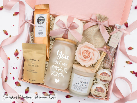 Personalized Valentine's Day spa gift set for her with bath treats, personalized glass tumbler, mocha latte coffe, caramels, relaxing candle, cozy socks, and a lovely rose. Pick from 1 of the three scents: Rose, Lavender, or Jasmine. Perfect to pamper and honor her.