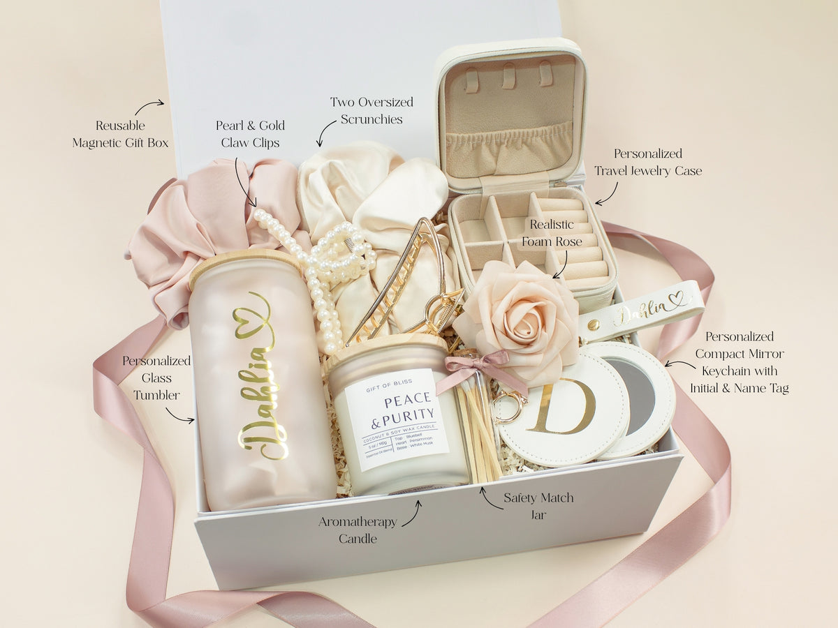 Blush personalized gift box for her with glass tumbler, jewelry case, candle, satin scrunchies, pearl hair accessories, gold claw clip, mirror and custom name details.