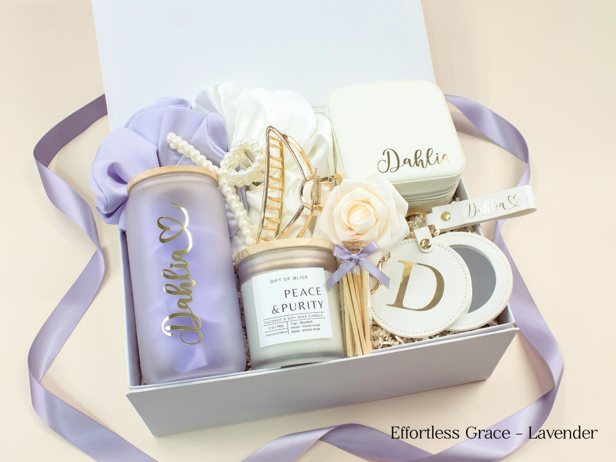 Lavender personalized gift box for women with glass tumbler, travel jewelry case, candle, satin scrunchies, pearl accessories, gold claw clip and custom mirror.