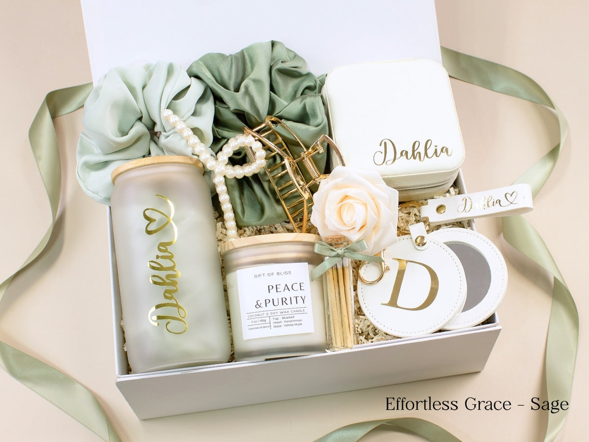 Sage green personalized gift box for her with glass tumbler, jewelry case, candle, satin scrunchies, pearl hair accessories, gold claw clip, mirror and custom name details.