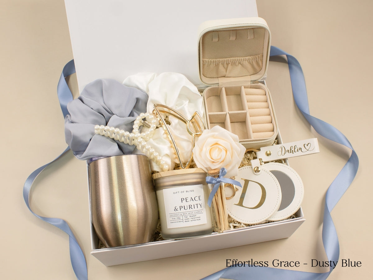 Dusty blue gift box for her with personalized jewelry case, wine tumbler, candle, satin scrunchies, pearl accessories, gold claw clip, mirror and custom name keychain.
