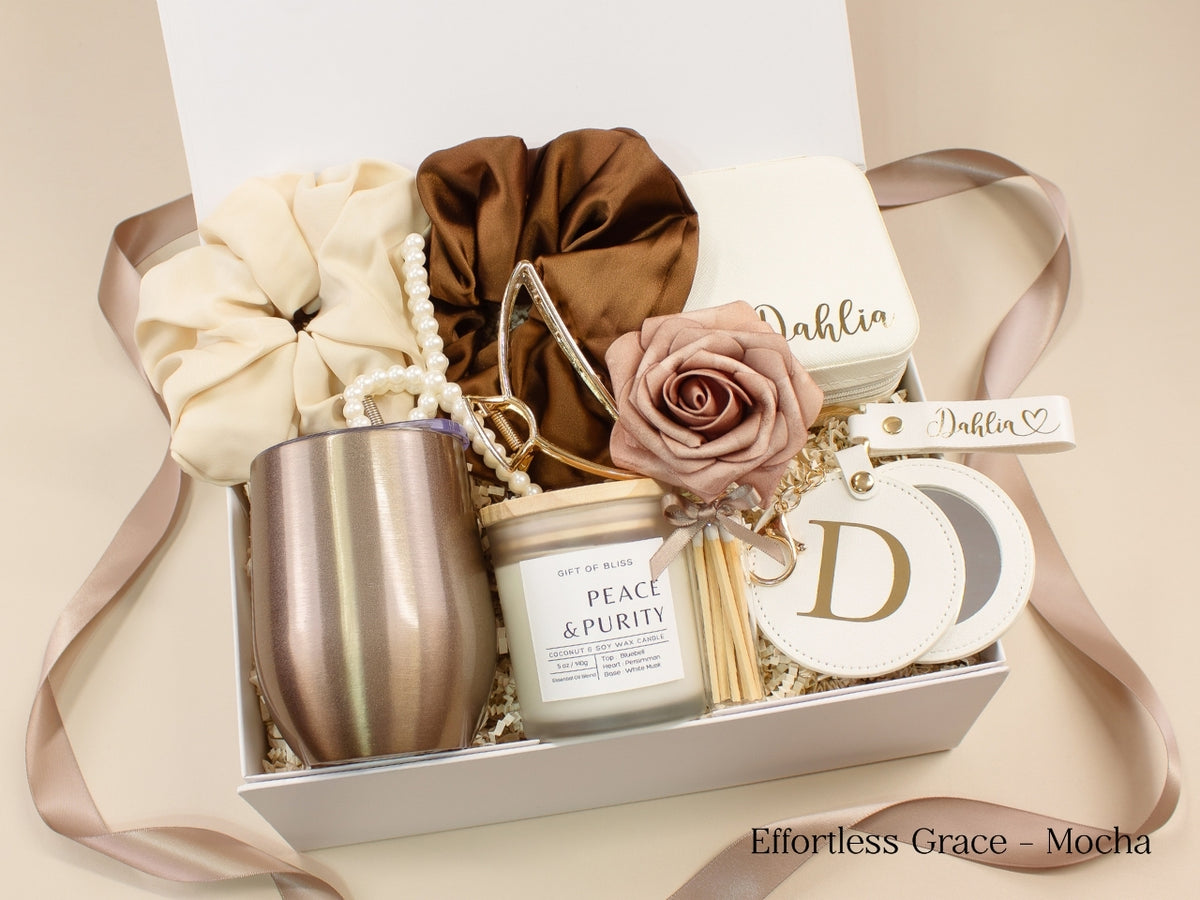 Personalized gift box for her in mocha and cream with wine tumbler, travel jewelry case, candle, satin scrunchies, pearl hair accessories, claw clip, mirror and custom name details.