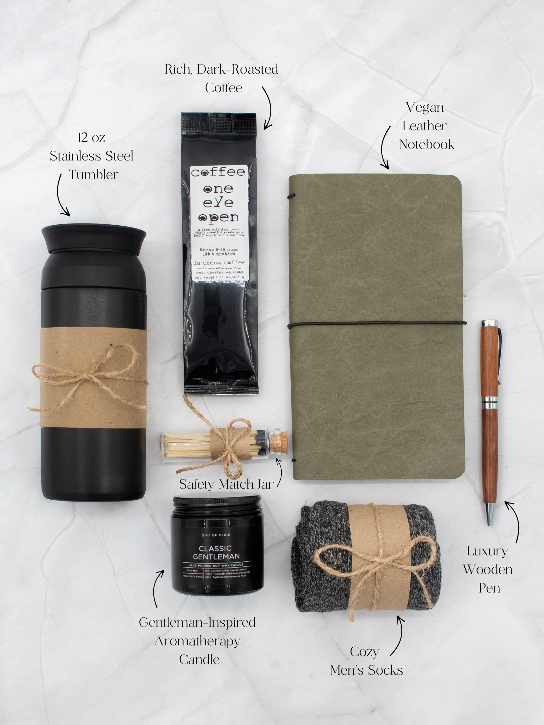 Specially crafted gift box for men, suitable for anyone valuing timeless style. Includes a stainless steel tumbler, coffee, aromatherapy candle, men's socks, notebook, and a wooden pen. A perfect gift for a comforting & indulgent experience.