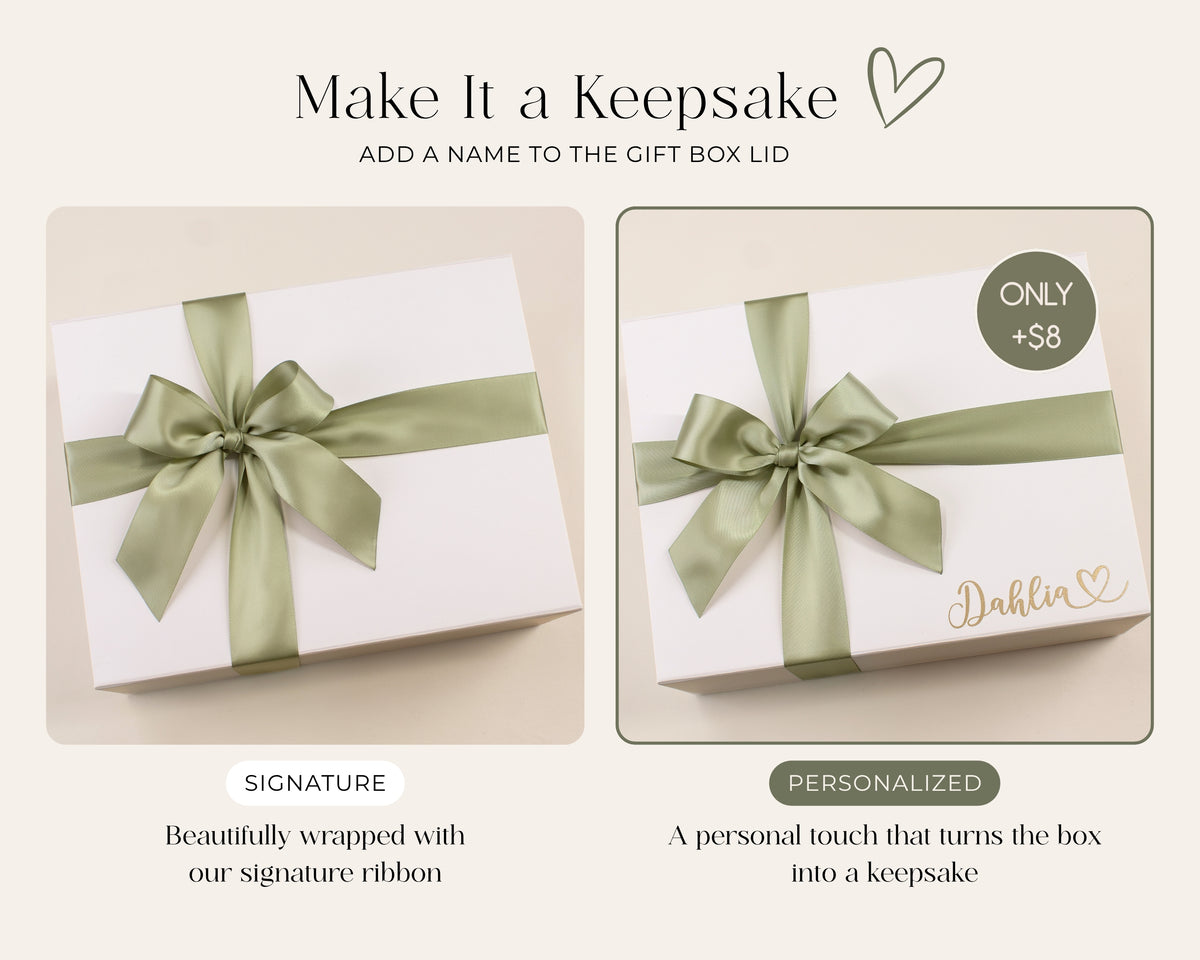 White gift box shown with sage satin ribbon, with an optional personalized recipient name in gold on the lid to turn the gift box into a keepsake.