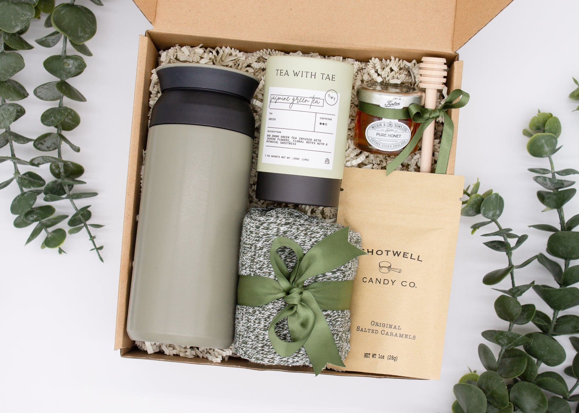 Specially crafted gift box for men, ideal for anyone. Includes a stainless steel tumbler, tea, honey, sweet treats, and cozy socks. Perfect for relaxation & appreciation, complete with a personalized greeting card.