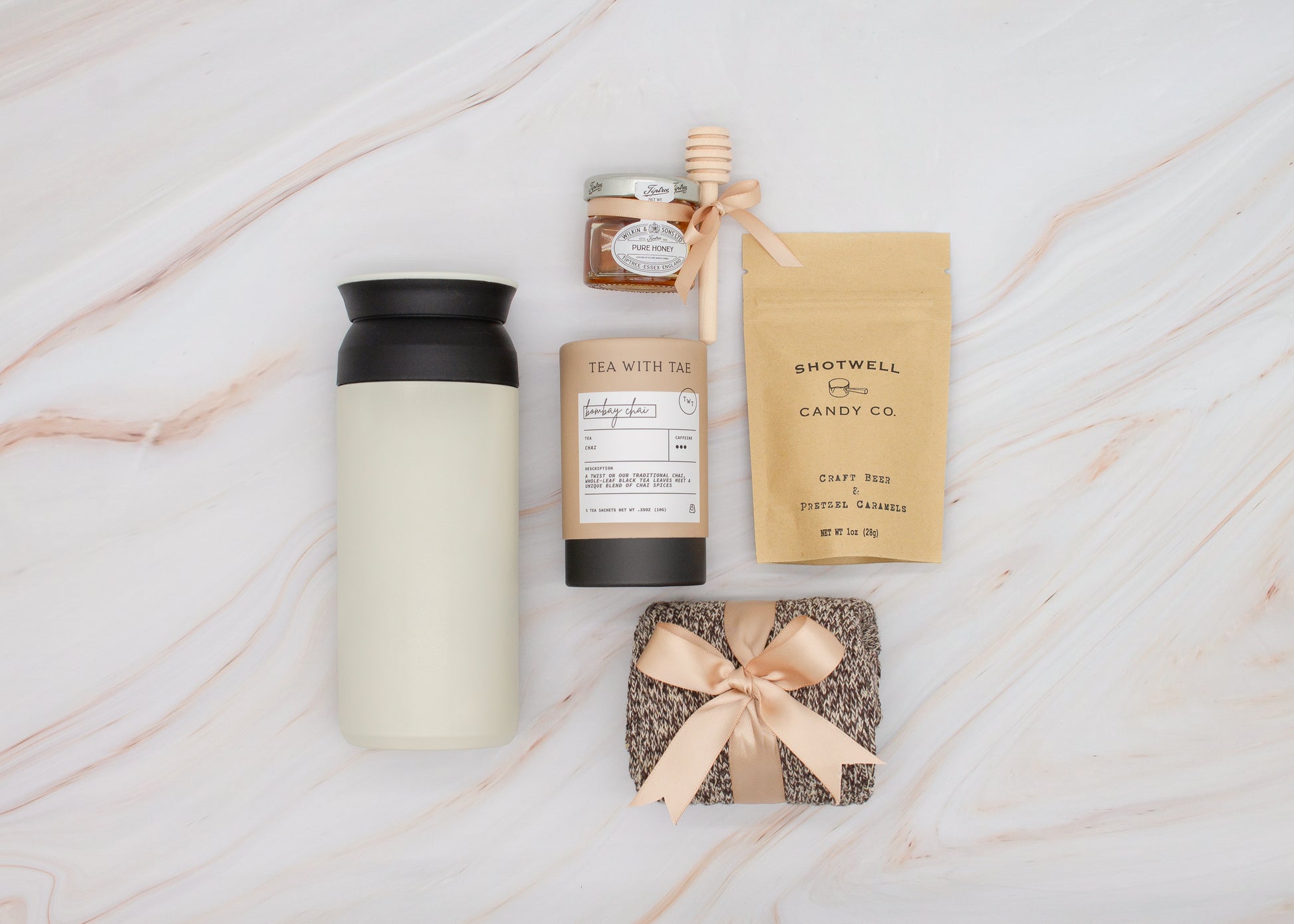 Specially crafted gift box for men, ideal for anyone. Includes a stainless steel tumbler, tea, honey, sweet treats, and cozy socks. Perfect for relaxation & appreciation, complete with a personalized greeting card.