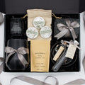 Specially crafted gift box that brings luxury and relaxation. Includes a 12oz stainless steel tumbler, sweet treats, an aromatic candle and matches, cozy socks, bath salt, shower steamers, and an elegant ceramic dish for a serene experience.