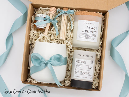 An elegance gift box for women, but perfect for anyone seeking sophistication. Includes a ceramic mug, aromatherapy candle and safety match jar, pure honey with dipper, and a mini tea tube. All beautifully arranged for a serene experience.