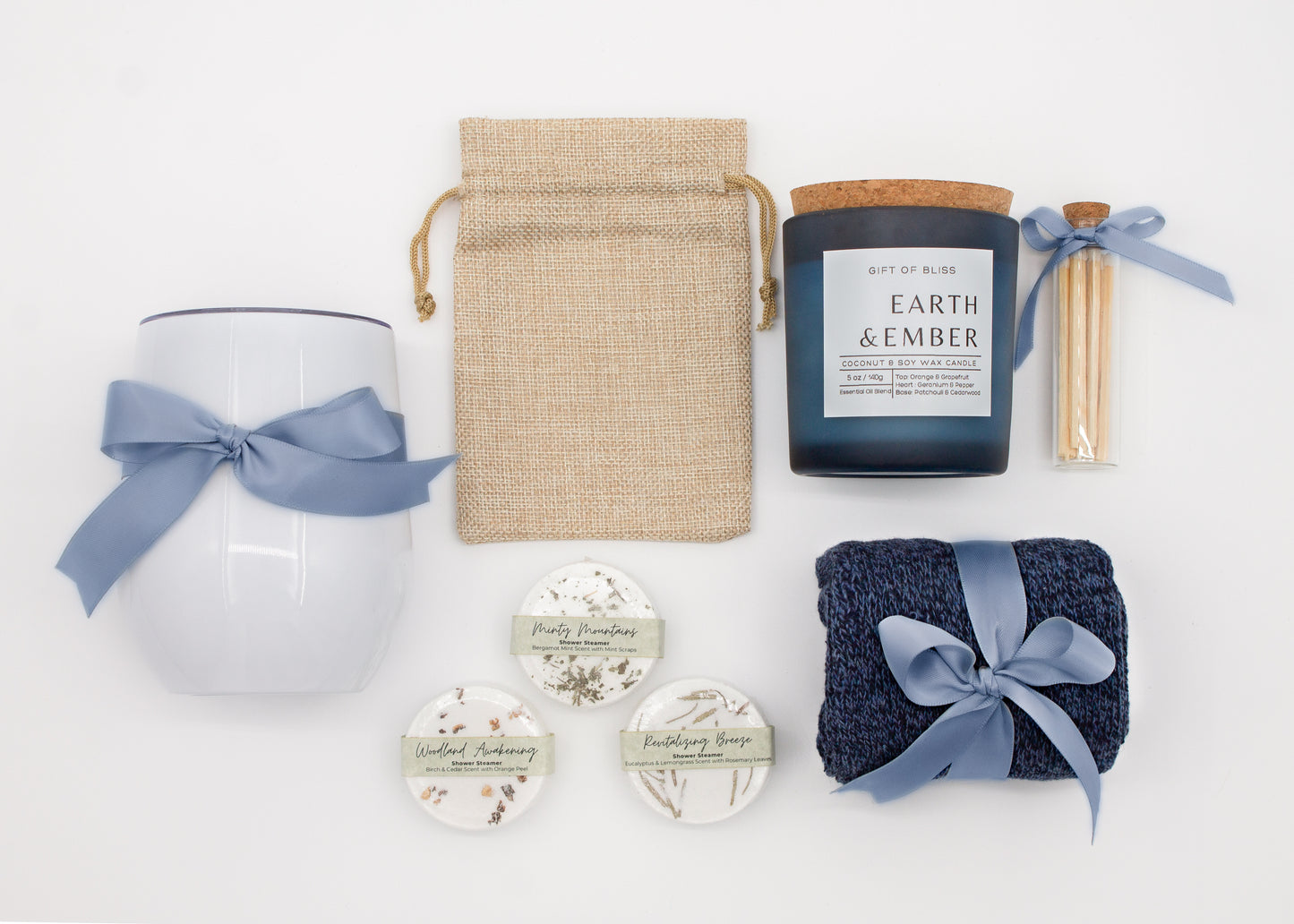 Specially crafted gift box that brings luxury and relaxation. Includes a 12oz stainless steel tumbler, sweet treats, an aromatic candle and matches, cozy socks, and a selection of shower steamer for a serene experience.
