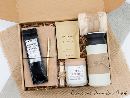 A specially crafted gift box for those who appreciate rustic charm and elegance. Features 12 oz tumbler, coffee, luxurious caramel, notebook with gold pen, soothing candle with matches, and cozy socks, perfect for both relaxation and practicality.