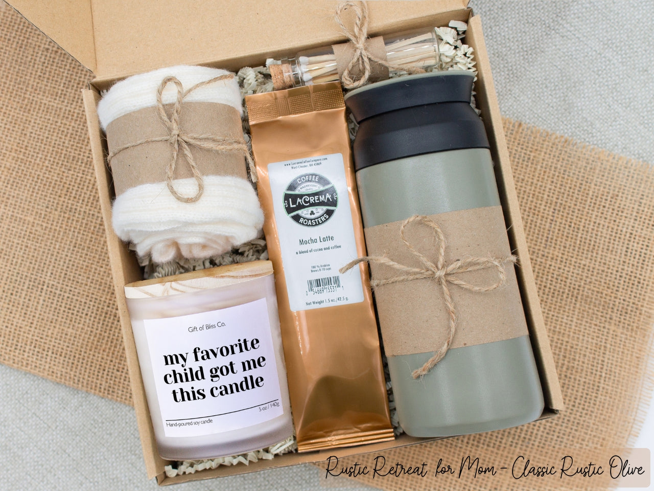 A specially crafted gift box for moms who appreciate rustic charm and elegance. Features 12 oz tumbler, coffee, soothing candle with matches, and cozy socks, perfect for both relaxation and practicality.