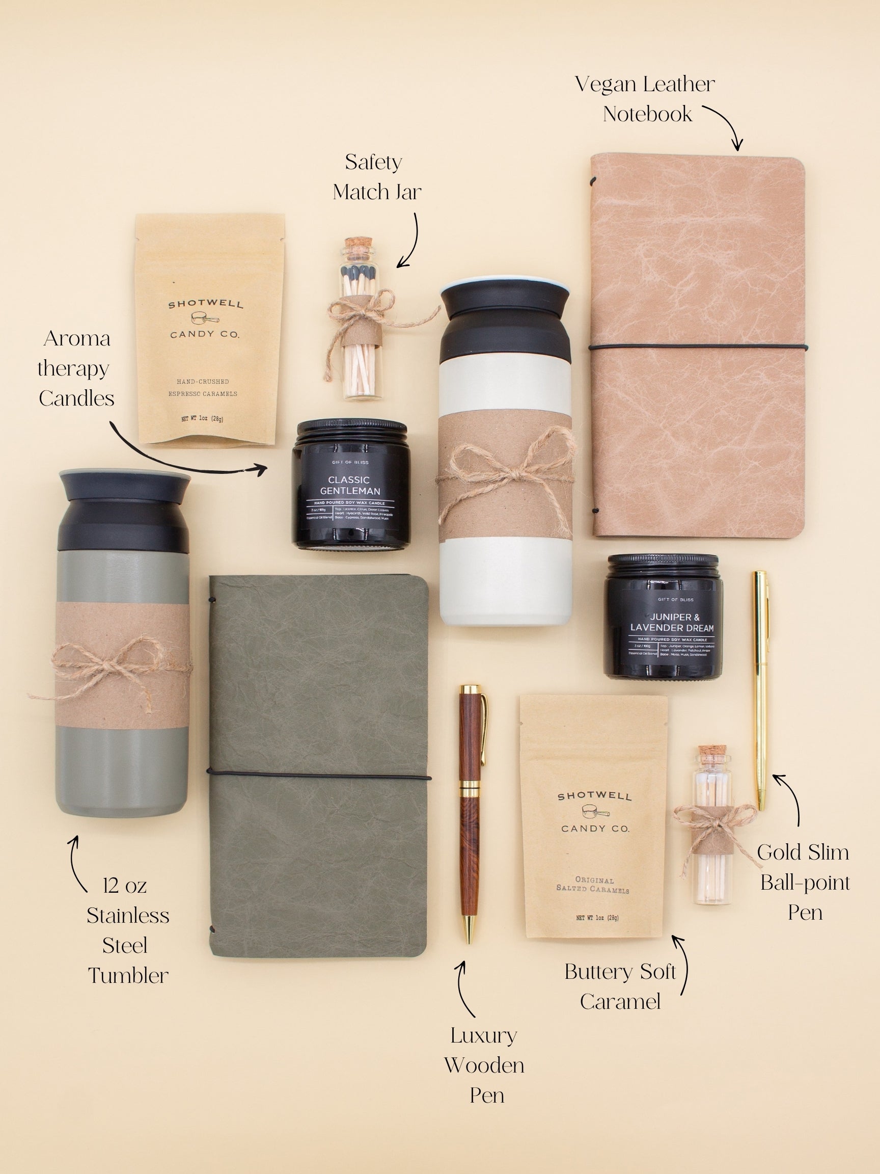 A gift box for two, features two stainless steel tumblers, two notebooks with a gold pen and a wooden pen, gourmet caramels, and two aromatic candles. Perfect for couples, friends, or colleagues to enjoy a relaxing, creative experience together.