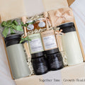 A gift box designed for two. Includes two stainless steel tumblers, a selection of fine tea and honey, elegant match jars, uniquely scented candles, and cozy socks for both. Ideal for creating shared moments of relaxation and connection.