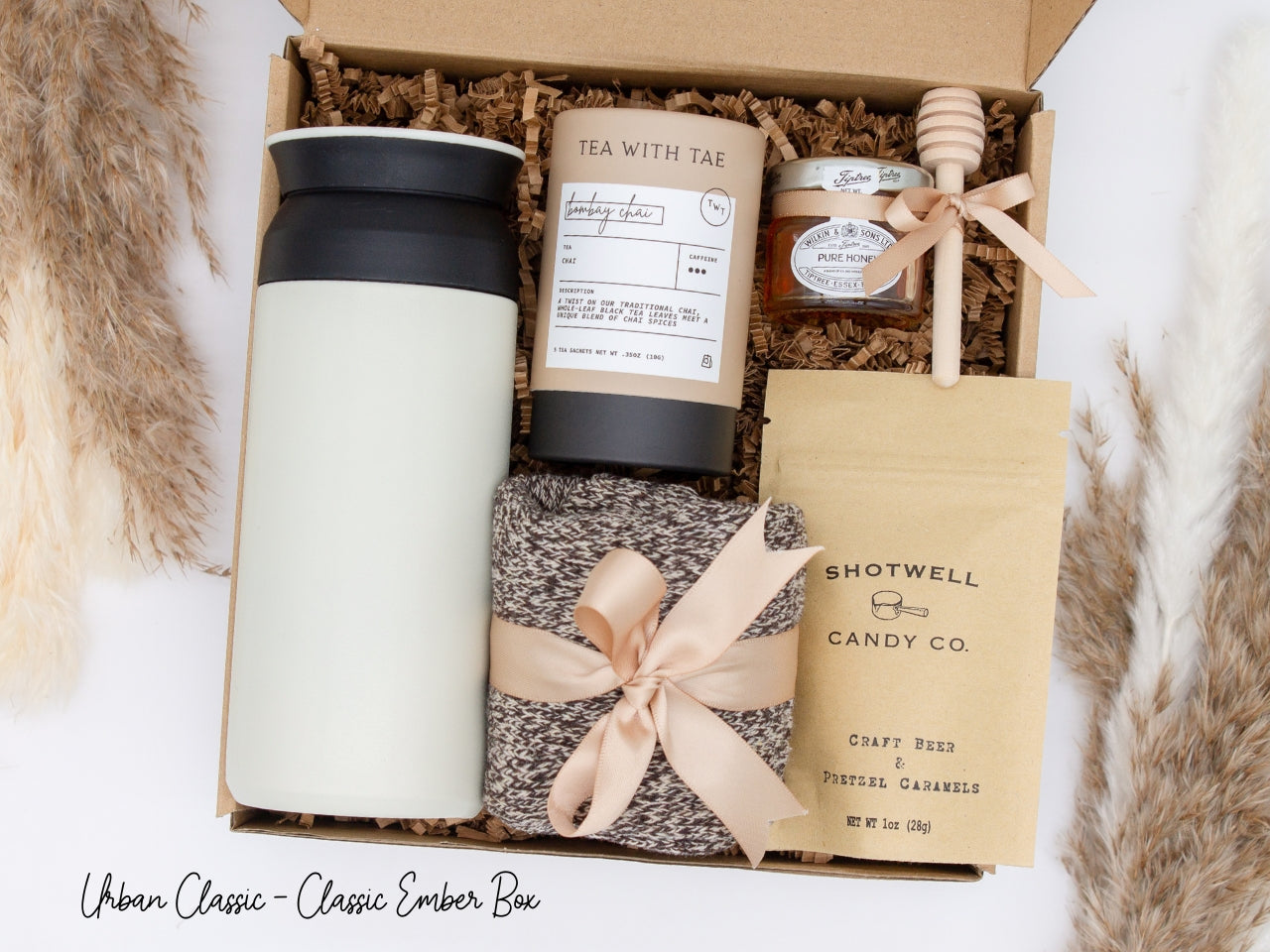 Specially crafted gift box for men, ideal for anyone. Includes a stainless steel tumbler, tea, honey, sweet treats, and cozy socks. Perfect for relaxation & appreciation, complete with a personalized greeting card.