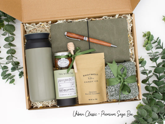 Specially crafted gift box for men, ideal for anyone. Includes a stainless steel tumbler, tea, honey, sweet treats, cozy socks, vegan leather notebook, & wooden pen. Perfect for relaxation & appreciation, complete with a personalized greeting card.