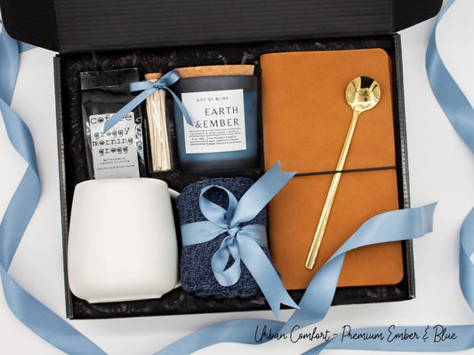Specially crafted gift box, ideal for modern individuals who value style and comfort. Includes 12 oz ceramic mug, long-handled golden spoon, rich coffee, aromatic candles and matches, stylish men's socks, and notebook, all arranged for a memorable experience.