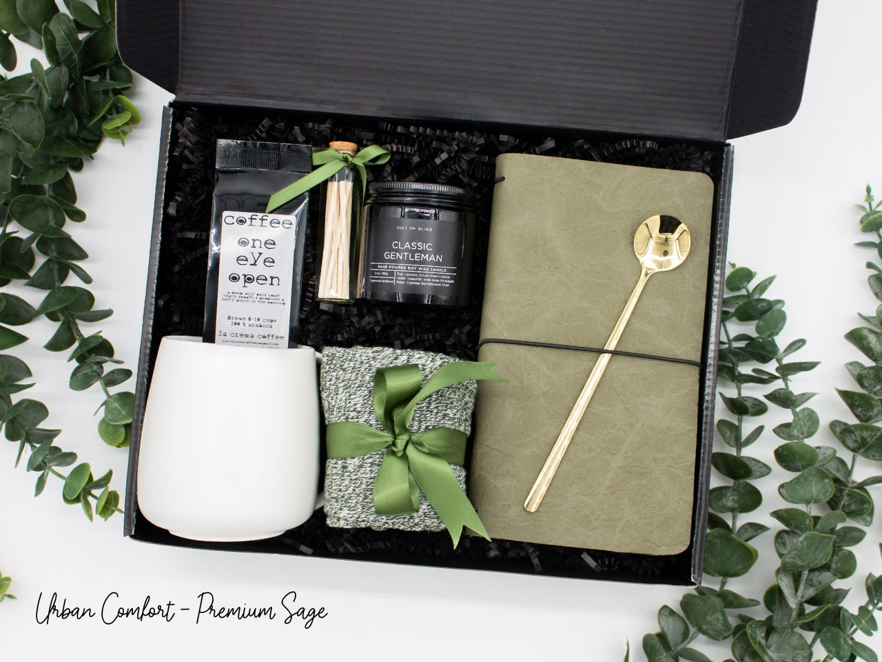 Specially crafted gift box, ideal for modern individuals who value style and comfort. Includes 12 oz ceramic mug, long-handled golden spoon, rich coffee, aromatic candles and matches, stylish men's socks, and notebook, all arranged for a memorable experience.