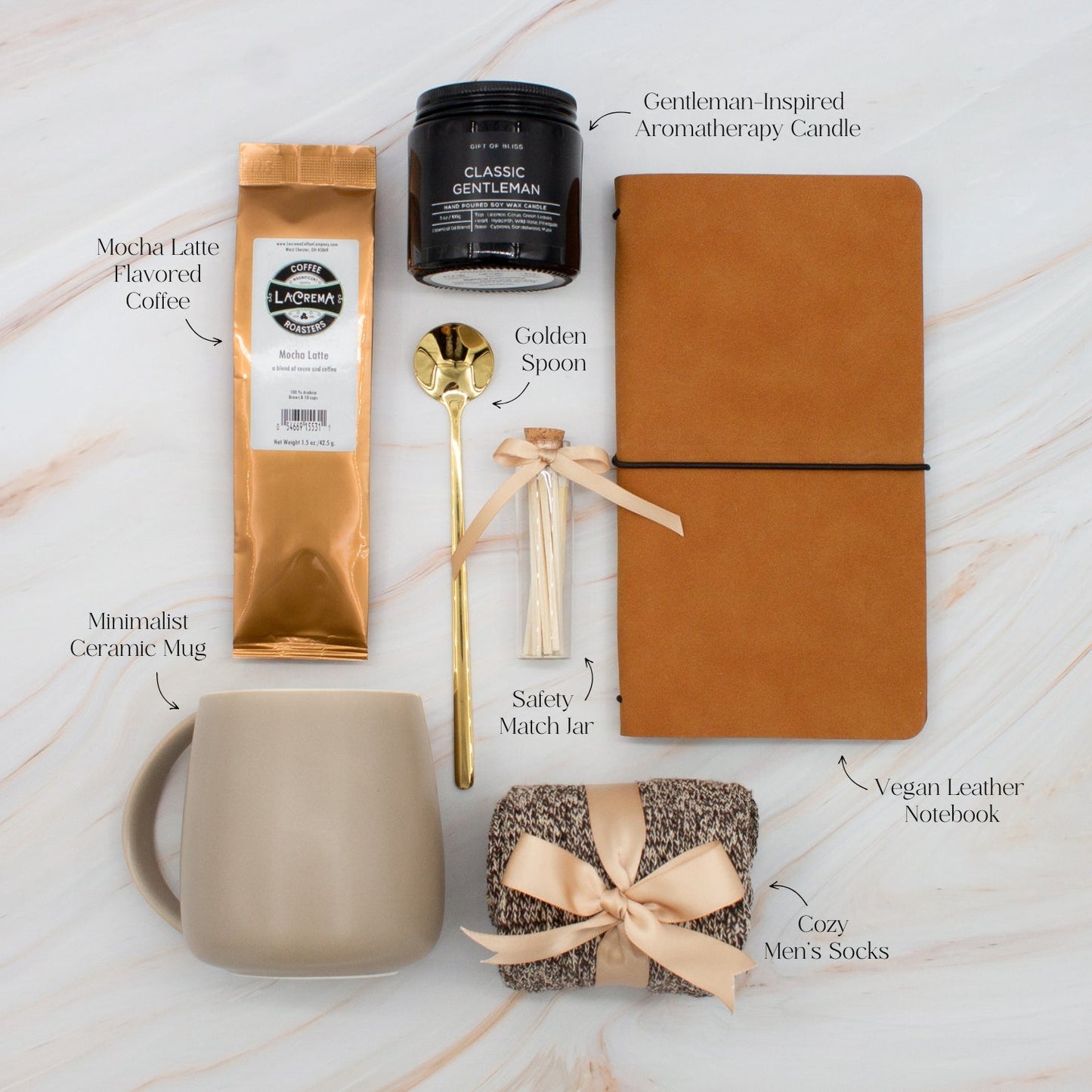 Specially crafted gift box, ideal for modern individuals who value style and comfort. Includes 12 oz ceramic mug, long-handled golden spoon, rich coffee, aromatic candles and matches, stylish men's socks, and notebook, all arranged for a memorable experience.