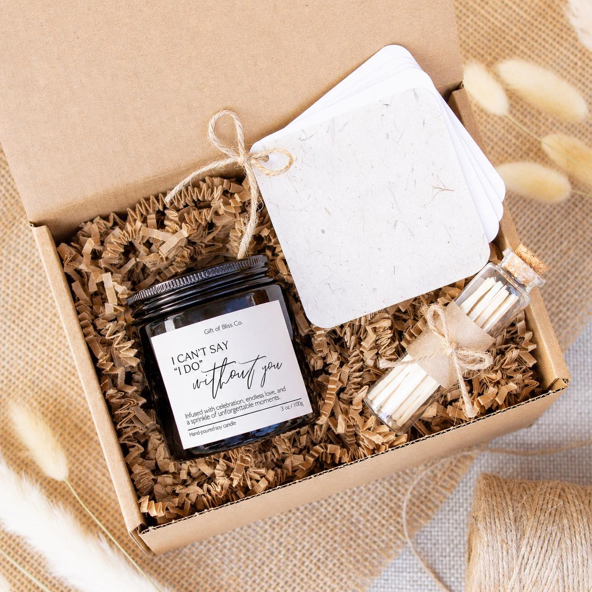 I Can't Say I Do Without You candle in a black jar with jute twine, safety matches and keepsake booklet in a kraft gift box